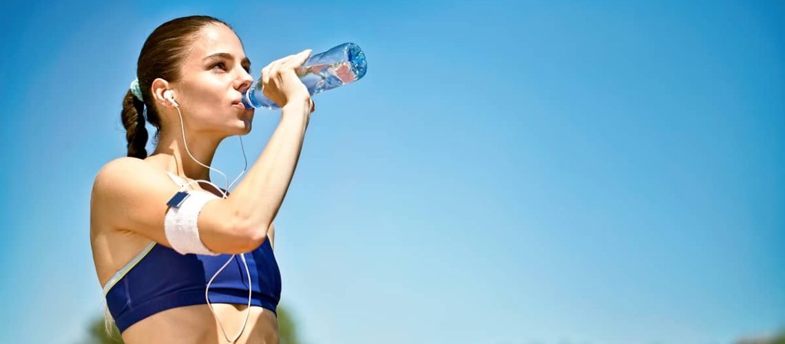 woman-athlete-drinking-water